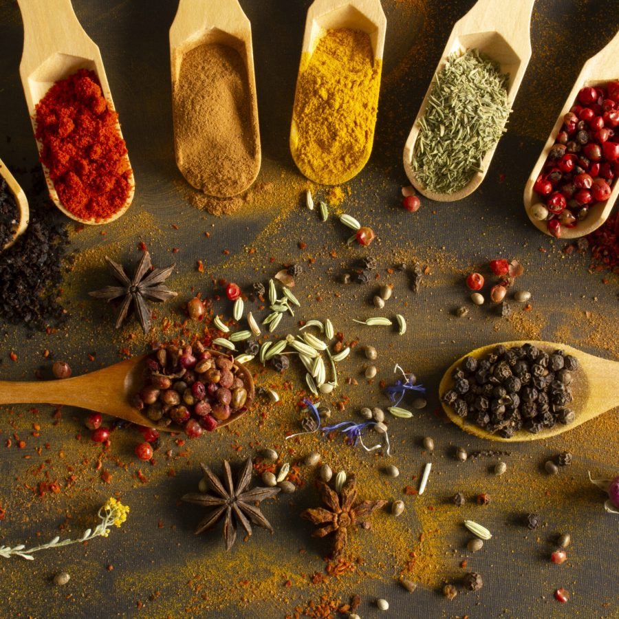 Colorful background from various spices in spoon